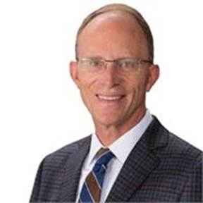 The image shows a well-dressed individual in a suit and tie, wearing a patterned shirt.

AI-generated content may be incorrect.